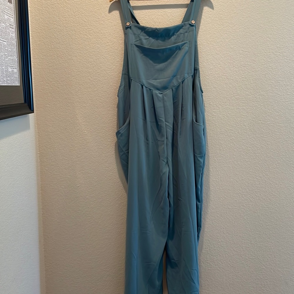 Wide leg pant jumpsuit with overall bib and button closure